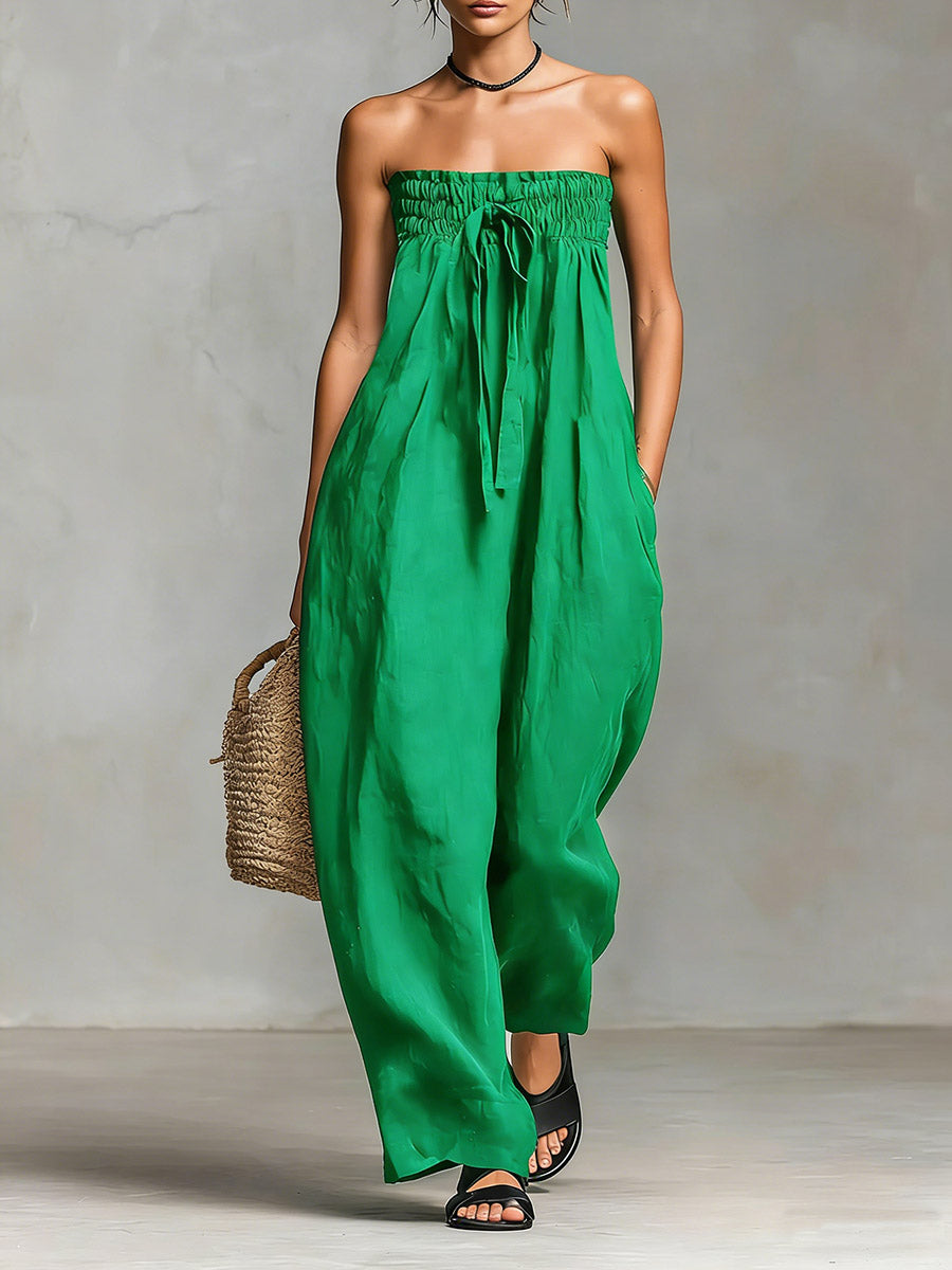Black Nova strapless flow maxi dress by THE WHITMORE FAMILY, featuring a flowing fabric and elegant strapless design.