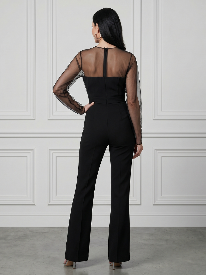 Black Oksana sheer fitted bodice flared leg jumpsuit by THE WHITMORE FAMILY, shown on a model with elegant design details.
