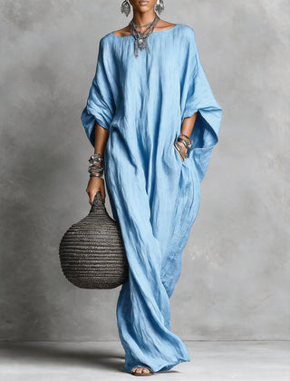 Black Serena oversized maxi dress by THE WHITMORE FAMILY with flowing fabric and relaxed fit, shown on a model.