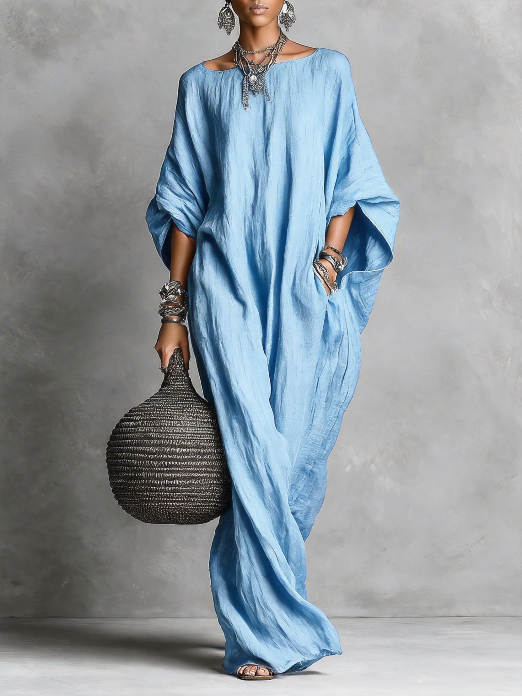 Black Serena oversized maxi dress by THE WHITMORE FAMILY with flowing fabric and relaxed fit, shown on a model.