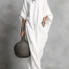Black Serena oversized maxi dress by THE WHITMORE FAMILY, flowing fabric, relaxed fit, and elegant long silhouette.