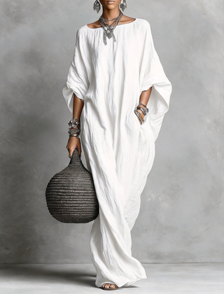 Black Serena oversized maxi dress by THE WHITMORE FAMILY, flowing fabric, relaxed fit, and elegant long silhouette.