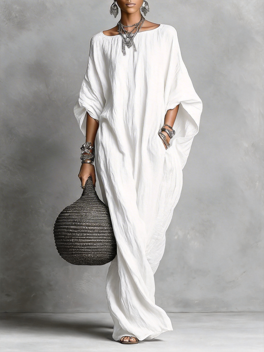 Black Serena oversized maxi dress by THE WHITMORE FAMILY, flowing fabric, relaxed fit, and elegant long silhouette.