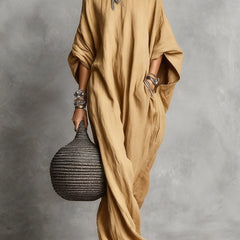 Black oversized Serena maxi dress by THE WHITMORE FAMILY, flowing fabric and relaxed fit for casual or elegant wear.