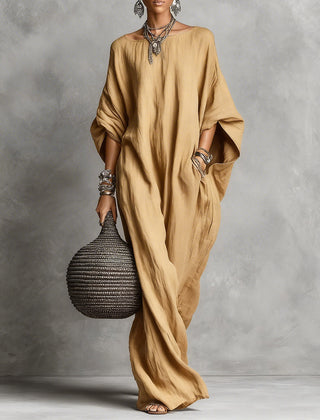 Black oversized Serena maxi dress by THE WHITMORE FAMILY, flowing fabric and relaxed fit for casual or elegant wear.