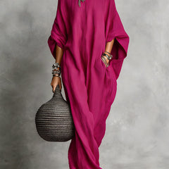 Black Serena oversized maxi dress by THE WHITMORE FAMILY, flowing fabric with a relaxed fit and elegant design.