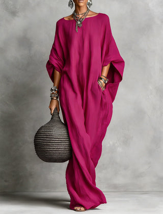 Black Serena oversized maxi dress by THE WHITMORE FAMILY, flowing fabric with a relaxed fit and elegant design.