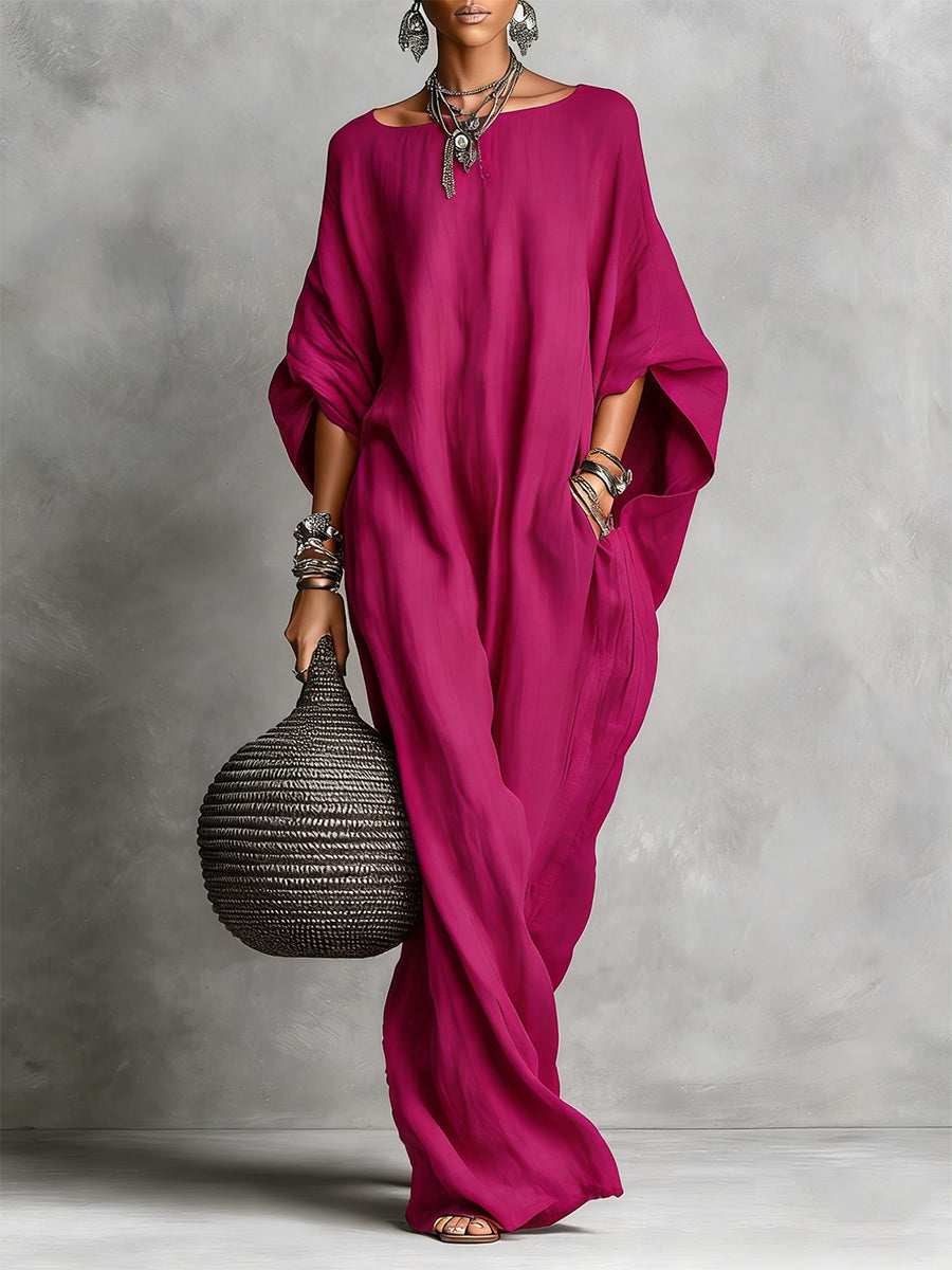 Black Serena oversized maxi dress by THE WHITMORE FAMILY, flowing fabric with a relaxed fit and elegant design.