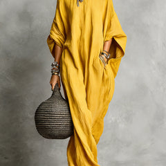 Black Serena oversized maxi dress by THE WHITMORE FAMILY, flowing fabric with a relaxed, elegant fit in the image.