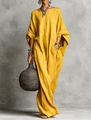 Black Serena oversized maxi dress by THE WHITMORE FAMILY, flowing fabric with a relaxed, elegant fit in the image.