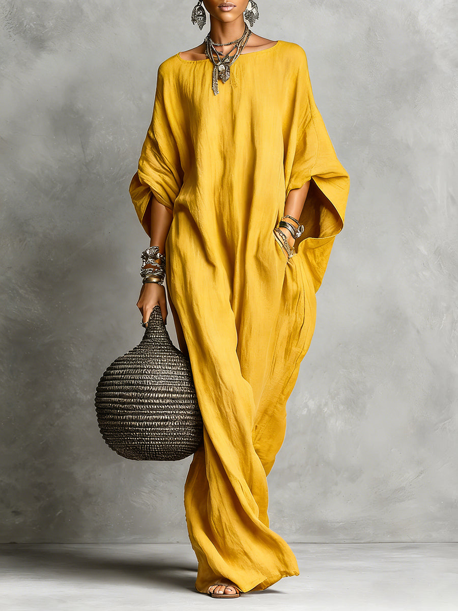 Black Serena oversized maxi dress by THE WHITMORE FAMILY, flowing fabric with a relaxed, elegant fit in the image.