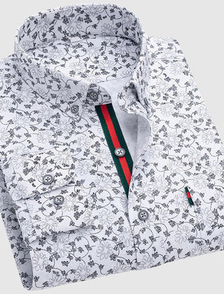 Valentino™ Floral Essence Shirt by THE WHITMORE FAMILY featuring a vibrant floral print and classic collar, displayed on a hanger.