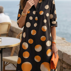 Black Vespera Sunset Dot Dress by THE WHITMORE FAMILY, featuring a flowy silhouette with sunset-inspired dot pattern.