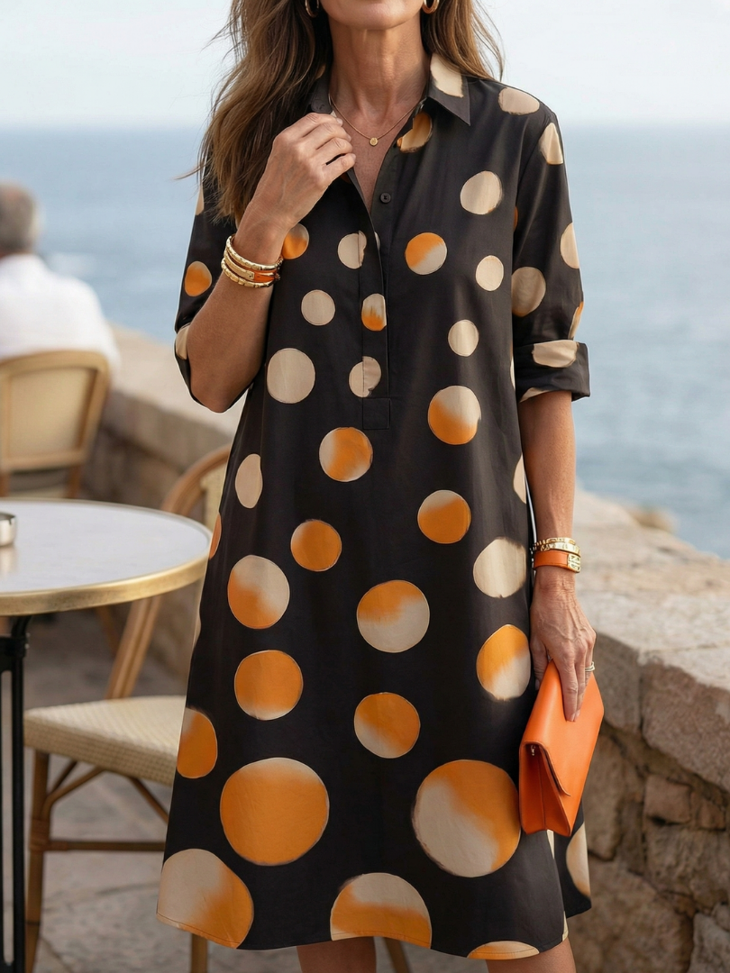 Black Vespera Sunset Dot Dress by THE WHITMORE FAMILY, featuring a flowy silhouette with sunset-inspired dot pattern.