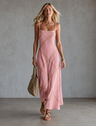 Black Amelia geometric print maxi dress by THE WHITMORE FAMILY, flowing fabric, sleeveless design, and bold pattern.