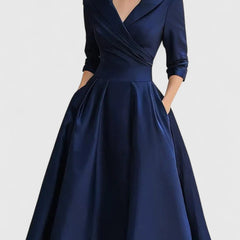Black Zyrah™ Elegant Midi Dress from THE WHITMORE FAMILY, featuring a sleek silhouette and stylish design.