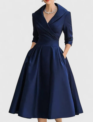 Black Zyrah™ Elegant Midi Dress from THE WHITMORE FAMILY, featuring a sleek silhouette and stylish design.