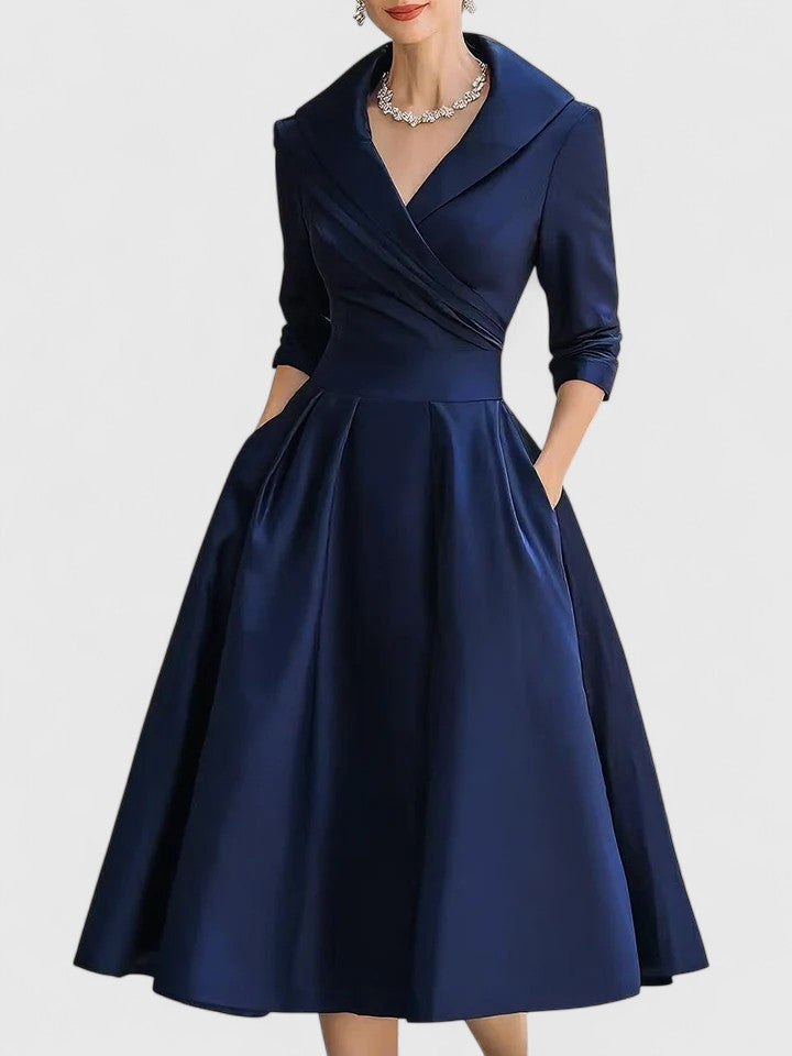 Black Zyrah™ Elegant Midi Dress from THE WHITMORE FAMILY, featuring a sleek silhouette and stylish design.