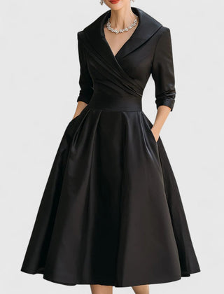 Black Zyrah™ Elegant Midi Dress by THE WHITMORE FAMILY, showcasing a fitted silhouette and stylish design.
