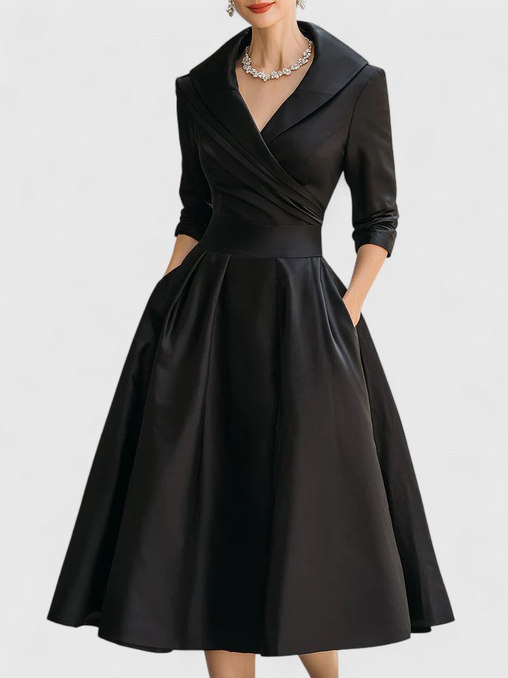 Black Zyrah™ Elegant Midi Dress by THE WHITMORE FAMILY, showcasing a fitted silhouette and stylish design.