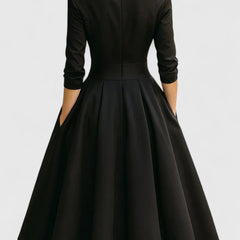 Black Zyrah™ Elegant Midi Dress from THE WHITMORE FAMILY, showcasing a fitted silhouette and stylish design.