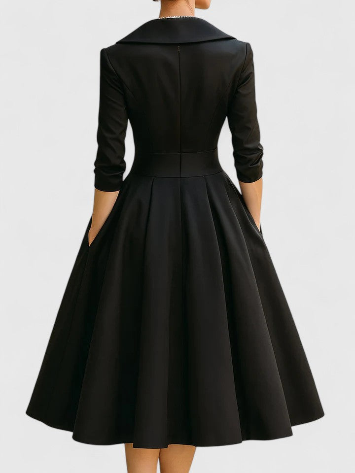 Black Zyrah™ Elegant Midi Dress from THE WHITMORE FAMILY, showcasing a fitted silhouette and stylish design.