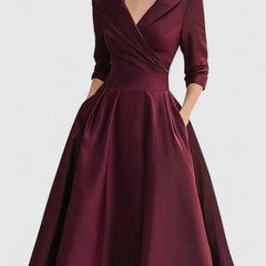Black Zyrah™ elegant midi dress from THE WHITMORE FAMILY, showcasing a fitted silhouette and stylish design.