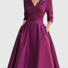 Black Zyrah™ Elegant Midi Dress by THE WHITMORE FAMILY, featuring a sophisticated design and flowing fabric.