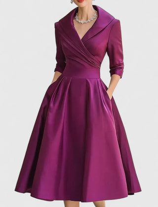 Black Zyrah™ Elegant Midi Dress by THE WHITMORE FAMILY, featuring a sophisticated design and flowing fabric.