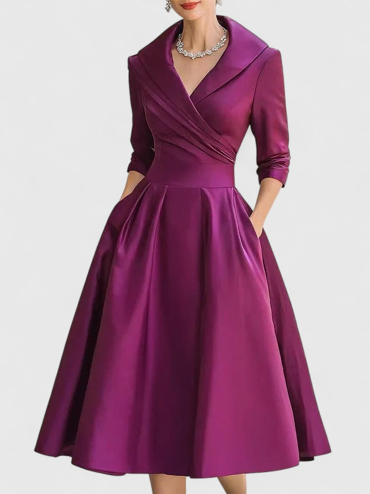 Black Zyrah™ Elegant Midi Dress by THE WHITMORE FAMILY, featuring a sophisticated design and flowing fabric.