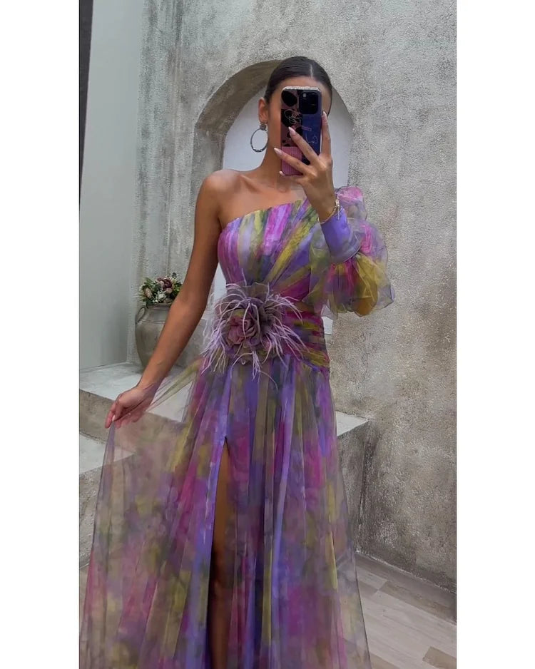 Helen colorful floral dress by THE WHITMORE FAMILY, elegant purple Bloemenjurk with intricate patterns and flowing fabric.