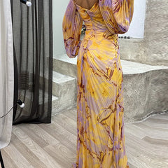 Willow elegant V-neck floral dress by THE WHITMORE FAMILY, featuring a stylish design and flowing fabric.