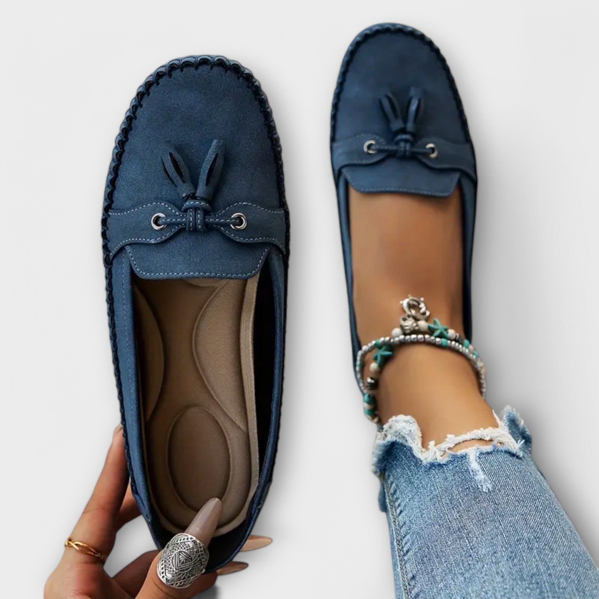 Blue Lisa stylish loafers from THE WHITMORE FAMILY featuring a sleek design and comfortable slip-on style.
