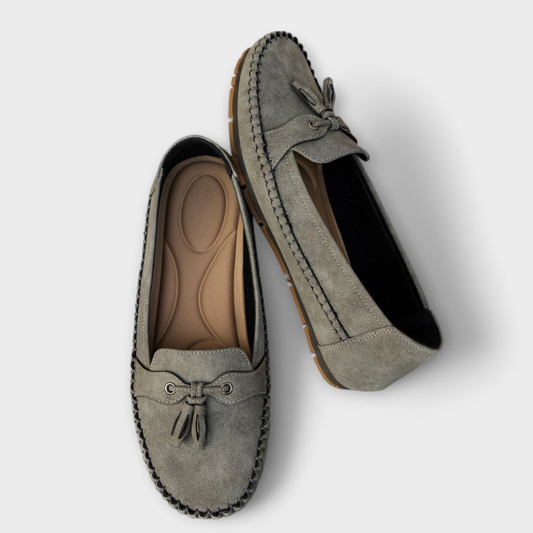 Blue Lisa stylish loafers from THE WHITMORE FAMILY with a sleek design and comfortable slip-on style.