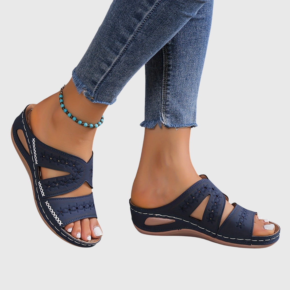 Noëlle™ lightweight orthopedic sandals by THE WHITMORE FAMILY in blue, with cushioned soles and adjustable straps for comfort.