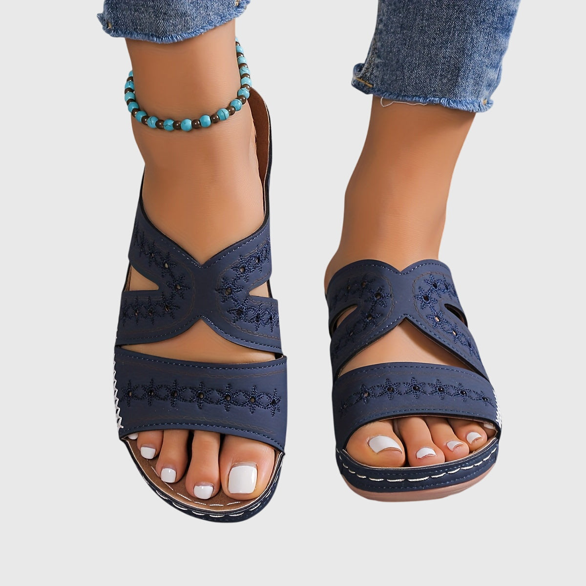 Noëlle™ lightweight orthopedic sandals in blue from THE WHITMORE FAMILY, showing cushioned sole and supportive strap design.