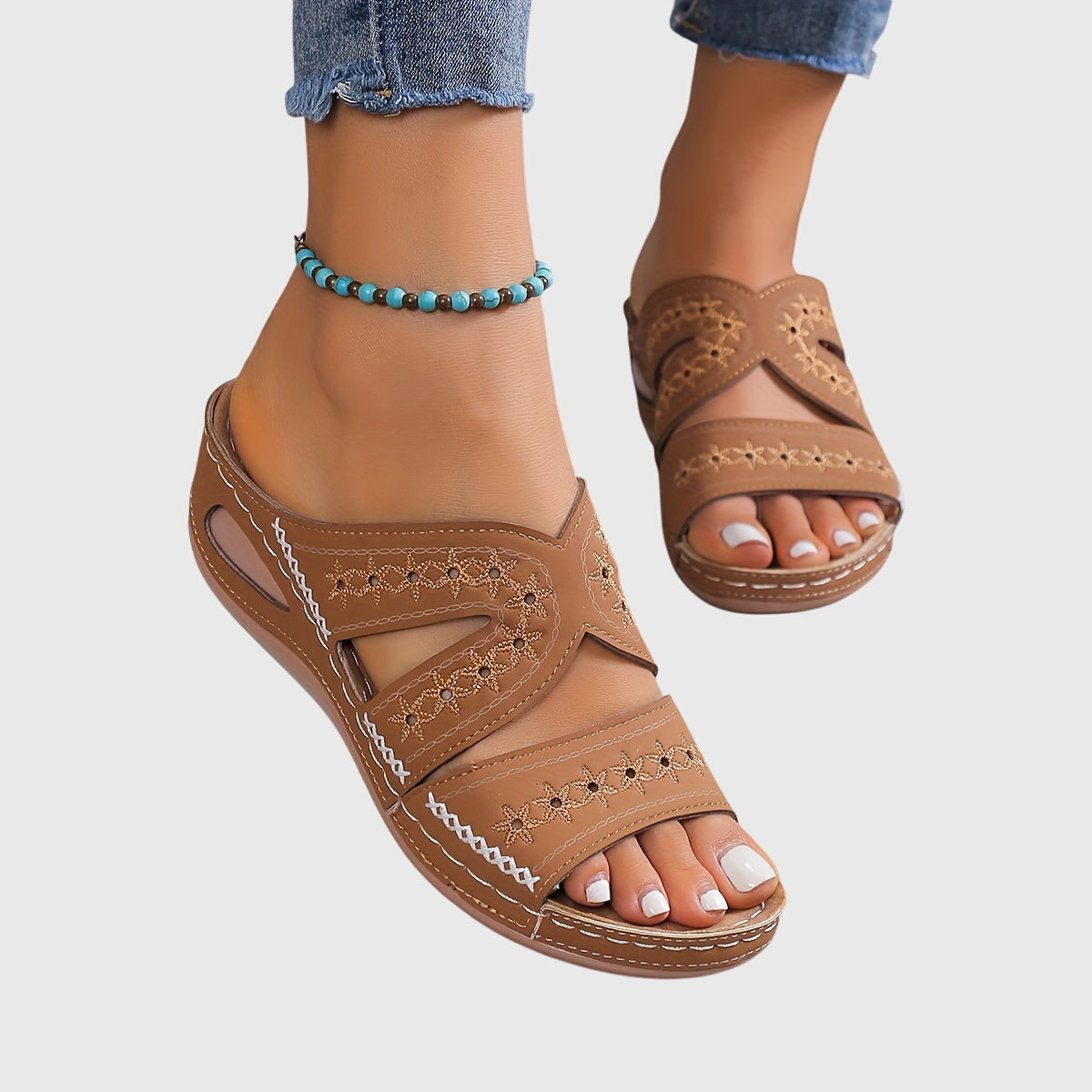 Blue Noëlle™ lightweight orthopedic sandals by THE WHITMORE FAMILY, featuring cushioned soles and supportive design for comfort.