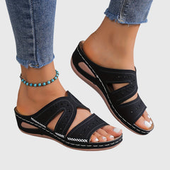 Blue Noëlle™ lightweight orthopedic sandals from THE WHITMORE FAMILY, featuring cushioned soles and supportive straps.