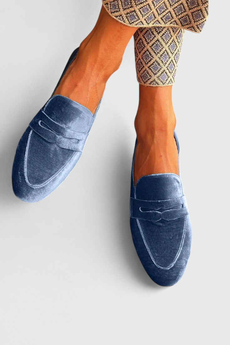 Blue Olivrah comfortable loafers by THE WHITMORE FAMILY, showcasing soft leather uppers and slip-on design.