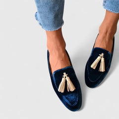 Blue Alessyra elegant loafers by THE WHITMORE FAMILY, showcasing sleek design and comfortable slip-on style.