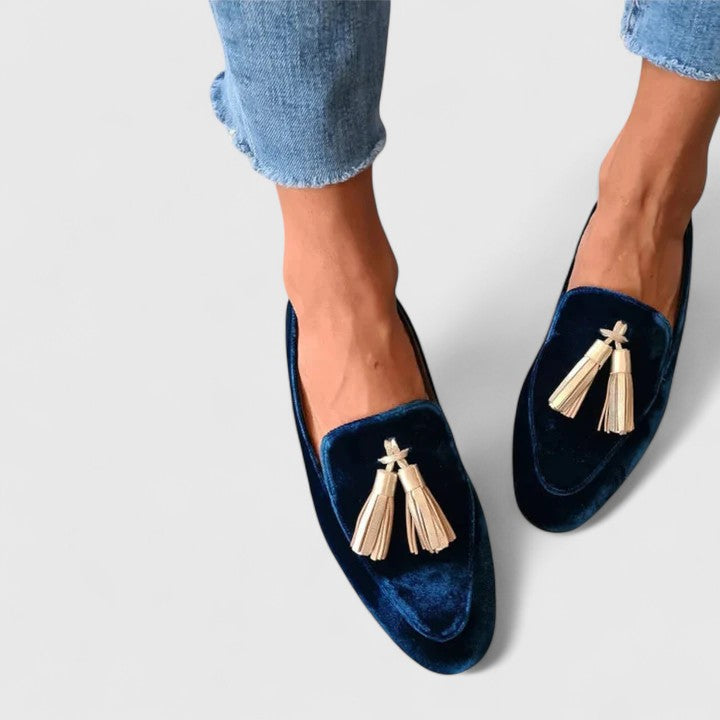Blue Alessyra elegant loafers by THE WHITMORE FAMILY, showcasing sleek design and comfortable slip-on style.