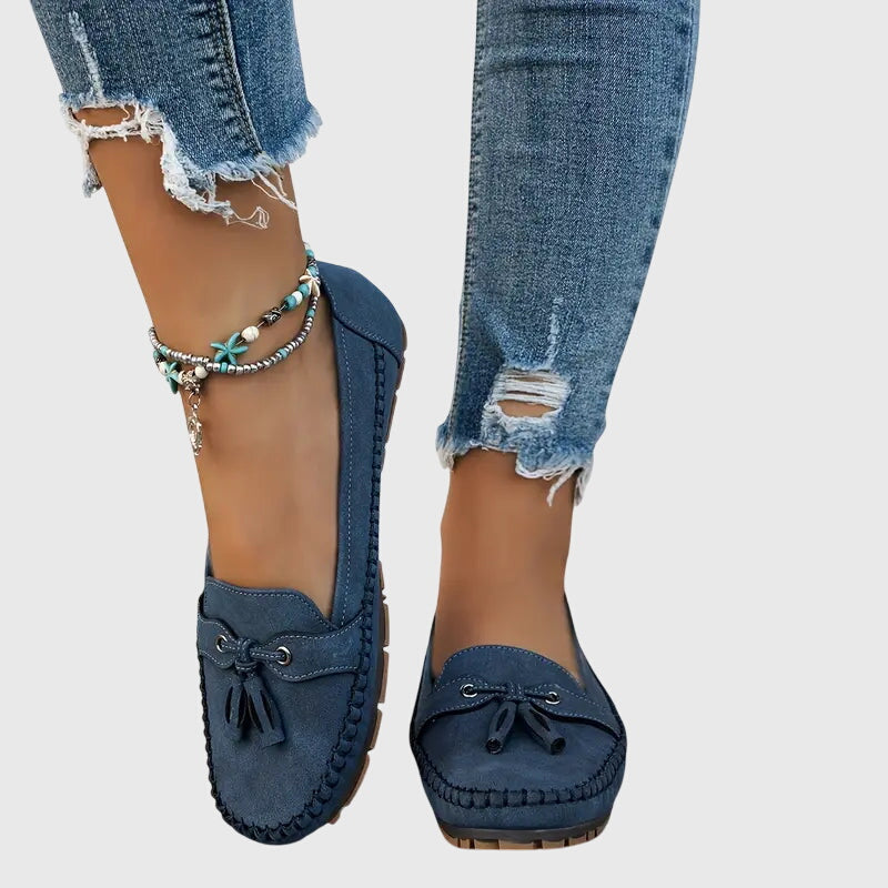 Blue Chelsea loafers by THE WHITMORE FAMILY, showcasing soft, comfortable slip-on shoes with a sleek design.