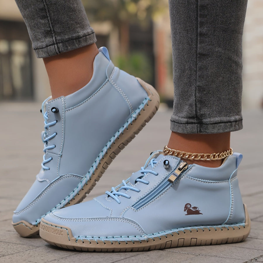 Blue Soline™ ergonomic support sneakers by THE WHITMORE FAMILY featuring cushioned soles and supportive design for comfort.