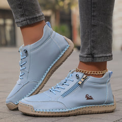 Blue Soline™ ergonomic support sneakers by THE WHITMORE FAMILY featuring cushioned soles and supportive design for comfort.