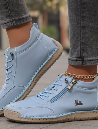 Blue Soline™ ergonomic support sneakers by THE WHITMORE FAMILY featuring cushioned soles and supportive design for comfort.