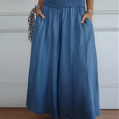Blue Lorraine™ comfortable pants with elastic waist from THE WHITMORE FAMILY, featuring a relaxed fit and soft fabric.