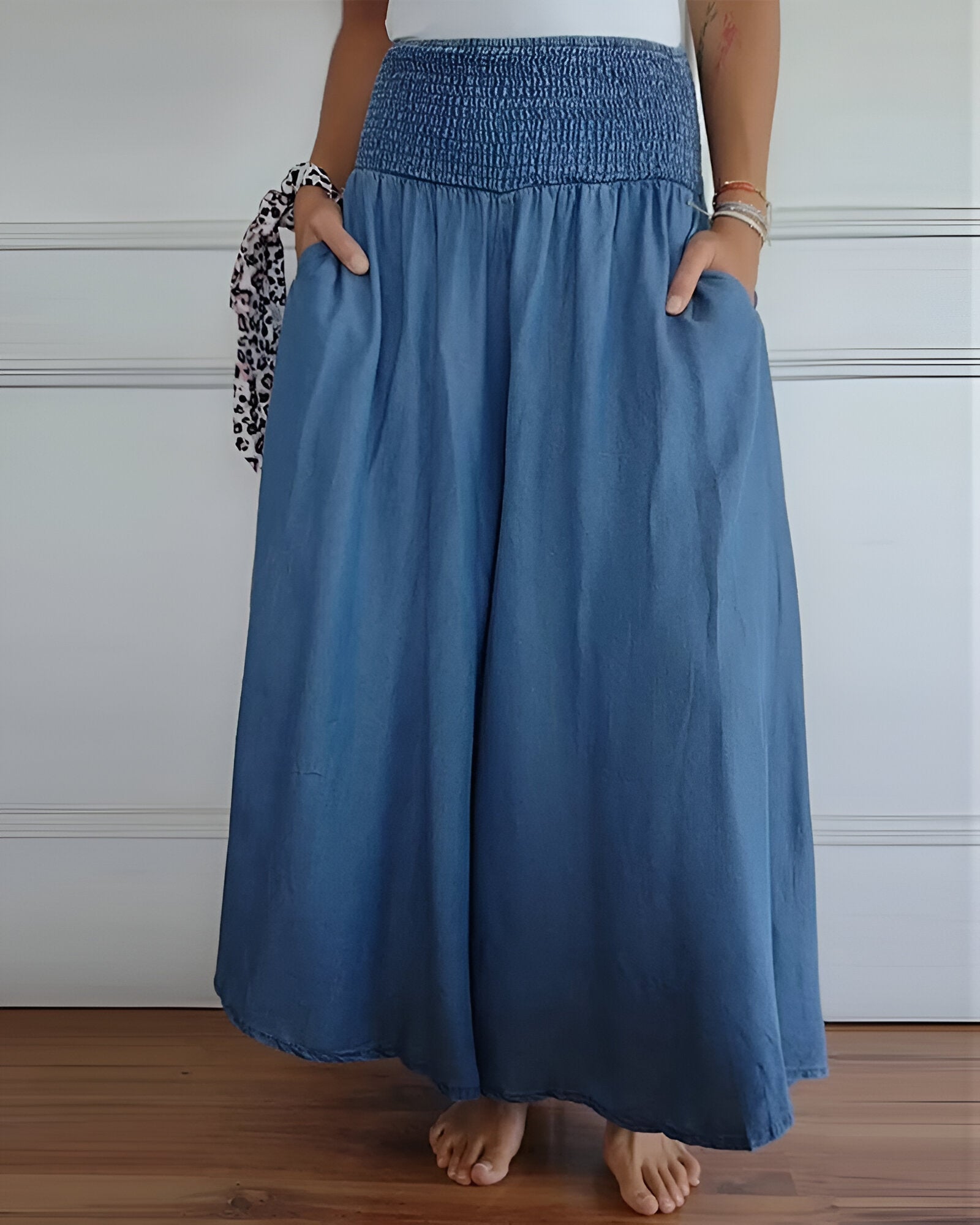 Blue Lorraine™ comfortable pants with elastic waist from THE WHITMORE FAMILY, featuring a relaxed fit and soft fabric.