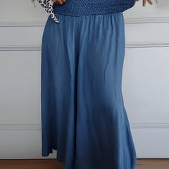 Blue Lorraine™ comfortable pants with elastic waist from THE WHITMORE FAMILY, featuring a relaxed fit and soft fabric.