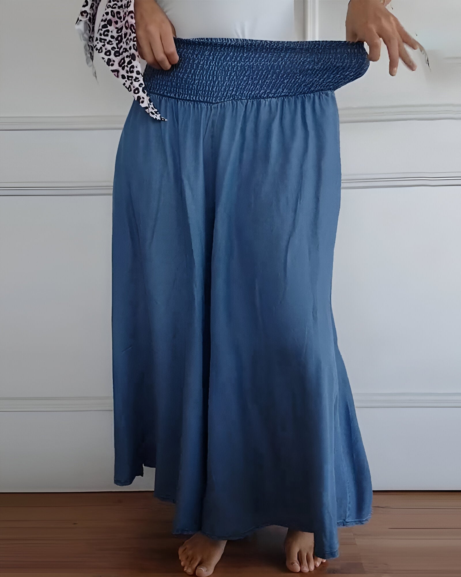 Blue Lorraine™ comfortable pants with elastic waist from THE WHITMORE FAMILY, featuring a relaxed fit and soft fabric.