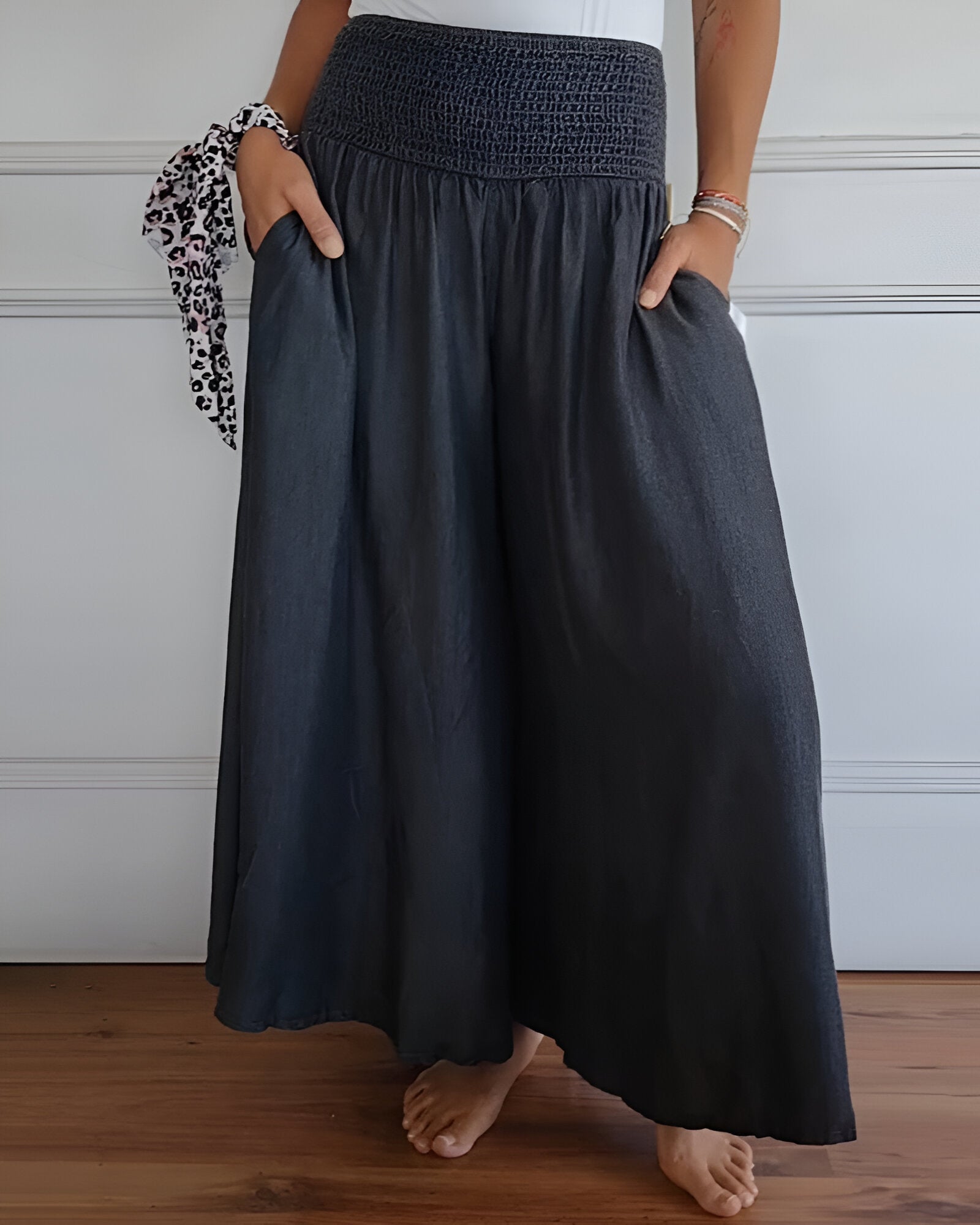 Blue Lorraine™ comfortable pants with elastic waist from THE WHITMORE FAMILY, shown on a model.